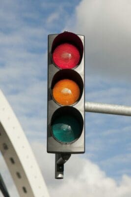 Close up of traffic lights against a blue sky 