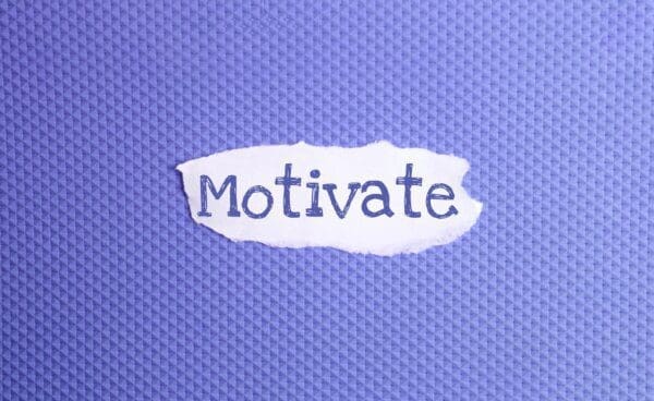 Motivate torn note on a gradient blue background