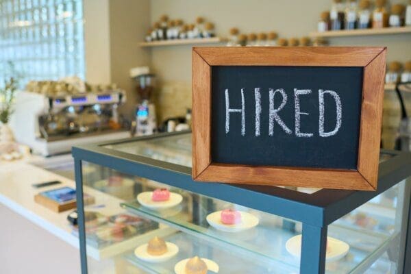 Hired sign on a table in a cafe