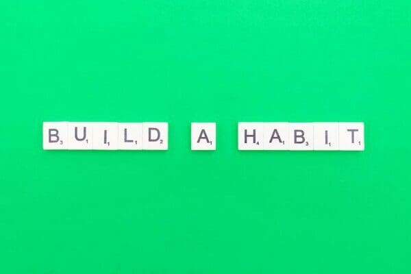 Build a habit spelled out on green background