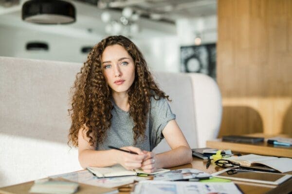 Female at her desk working creatively 