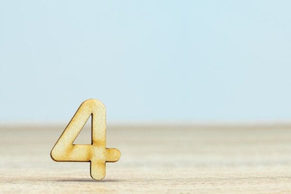 Gold number four on a blue and beige background