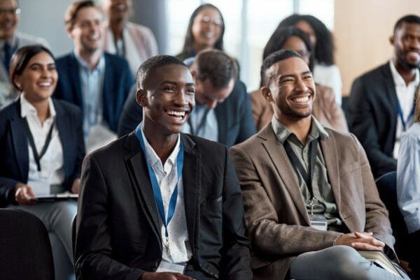 Smiling businesspeople at a conference