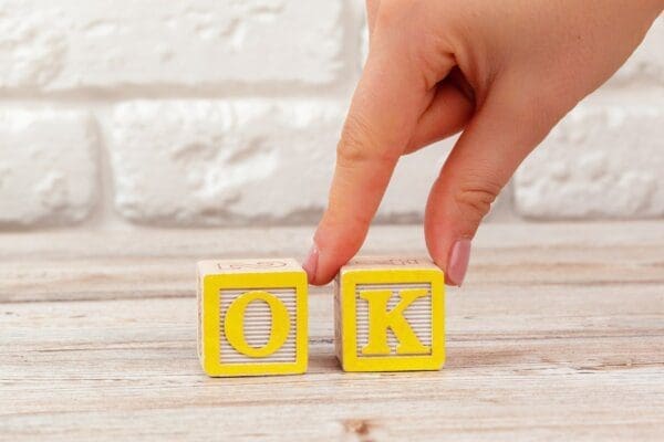 OK spelled by yellow wooden toy Blocks for the Four Life Positions in Transactional Analysis?