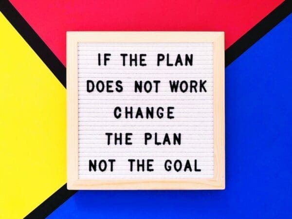 If the plan does not work change the plan not the goal quaote on pink, yellow, and blue background