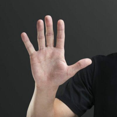 Male hand showing palm five fingers gesture