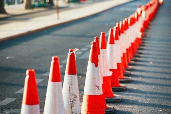 Orange traffic cones lining the road