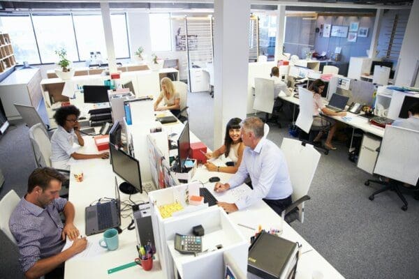 Birdseye's view of many HR employees working in a big office represents shared HR service