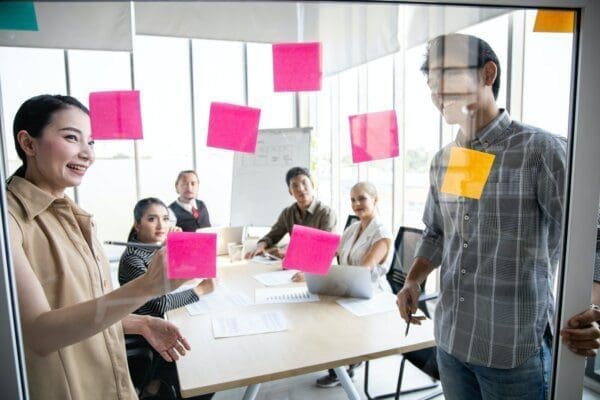 Business people meeting at office with use post it notes to show vision