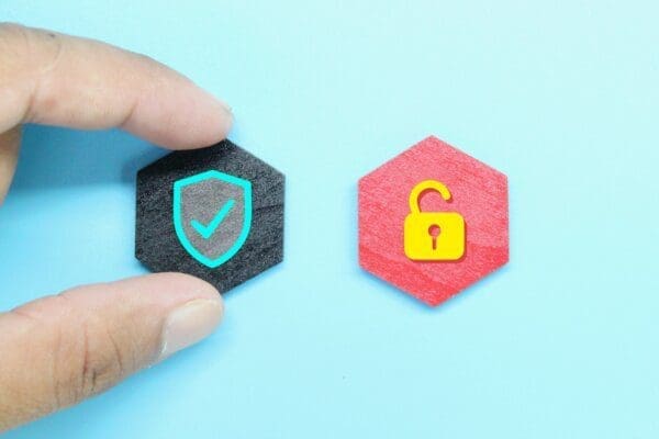 2 hexagons with security and unlocked padlock icons representing safety and security for virtual work