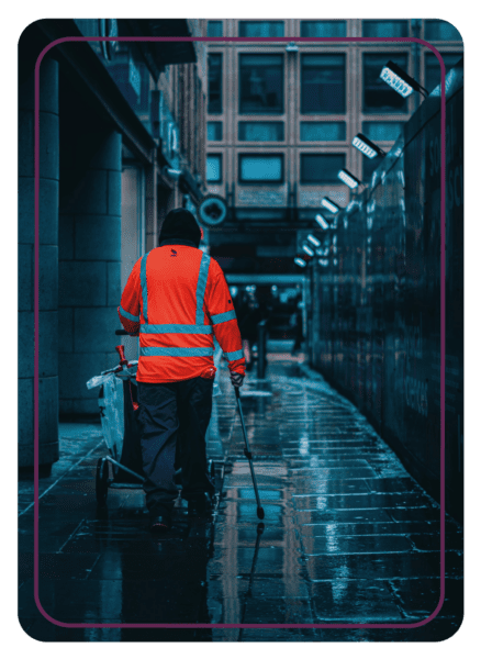 Picture Coaching Card from MBM showing the back of street cleaner in an orange vest