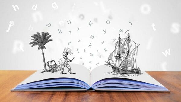 Open story book with letters and pictures coming to life represents creativity
