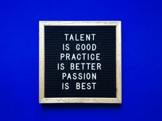 Passion quote written on felt board against blue background