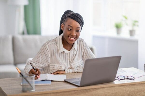 Young black lady having online training from home