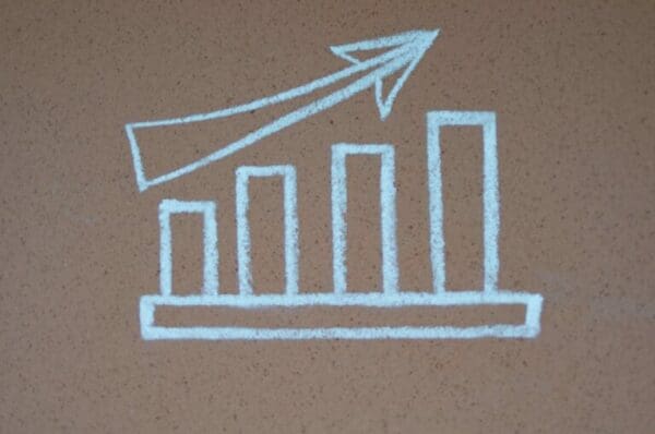 Chalk drawing on a bar graph with an upwards arrow