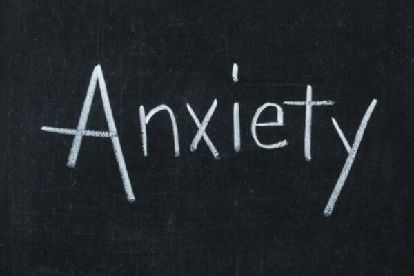 Anxiety written with white chalk on a blackboard