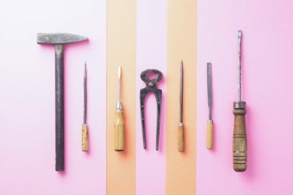 Work tools on light purple and pink background