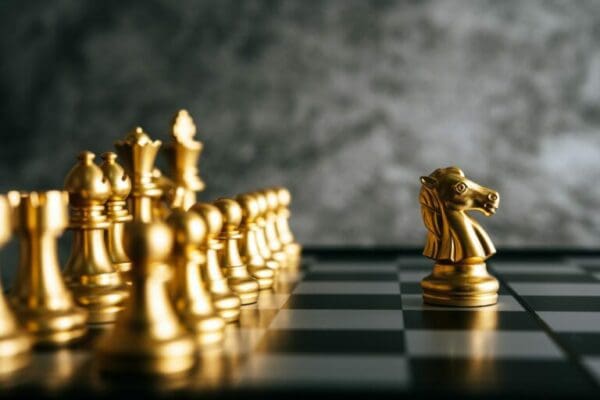 Gold Chess on chess board game represents a leader
