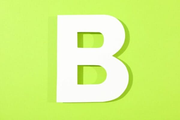 White letter B on green color background