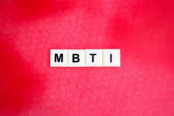 MBTI alphabet letters or Myers-Briggs Type Indicator on pink background