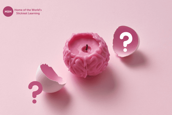 Pink brain candle with question signs
