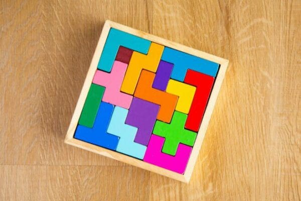 complete colourful wooden puzzle on wooden surface