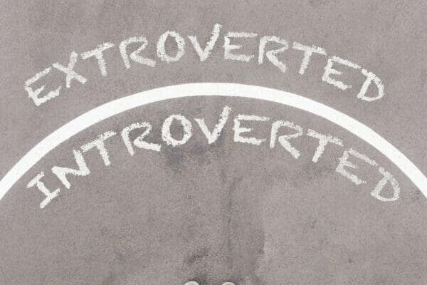 Extroverted vs Introverted text on asphalt ground