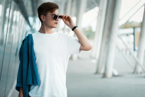 Confident man in sunglasses and white tshirt