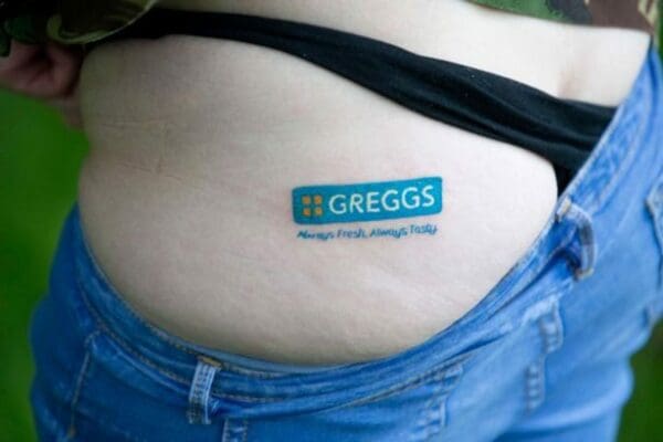 Greggs tattoo on a person's butt