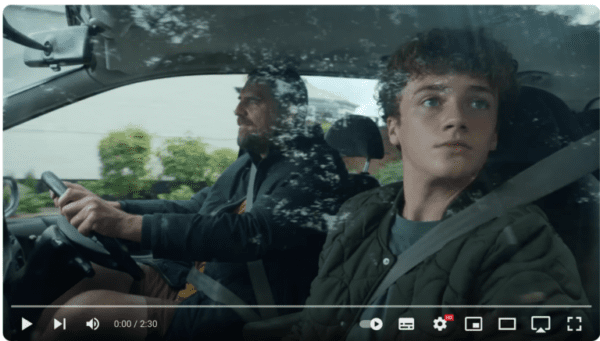 Screenshot from the Tesco Christmas advert with Dad and son in the car.