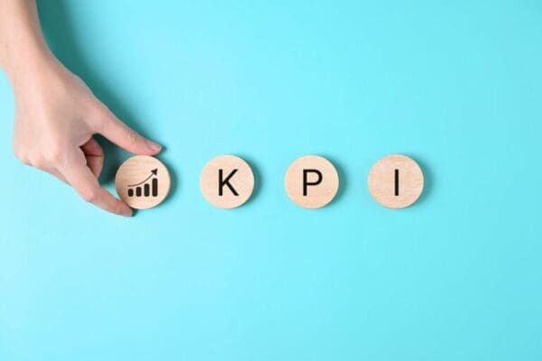Letters KPI for Key performance indicator on blue background