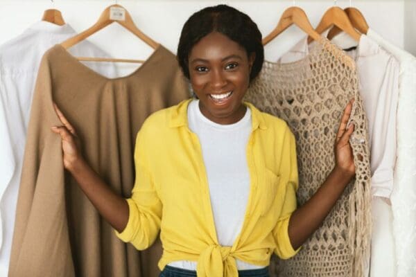 African American woman choosing from her wardrobe