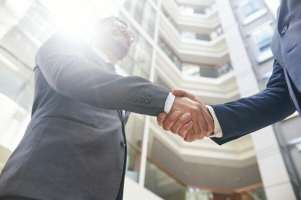 Two businessman shaking hand after the completion of Successful Negotiations