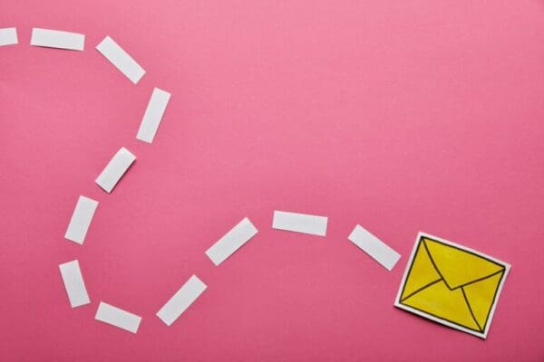 Yellow email letter on pink background